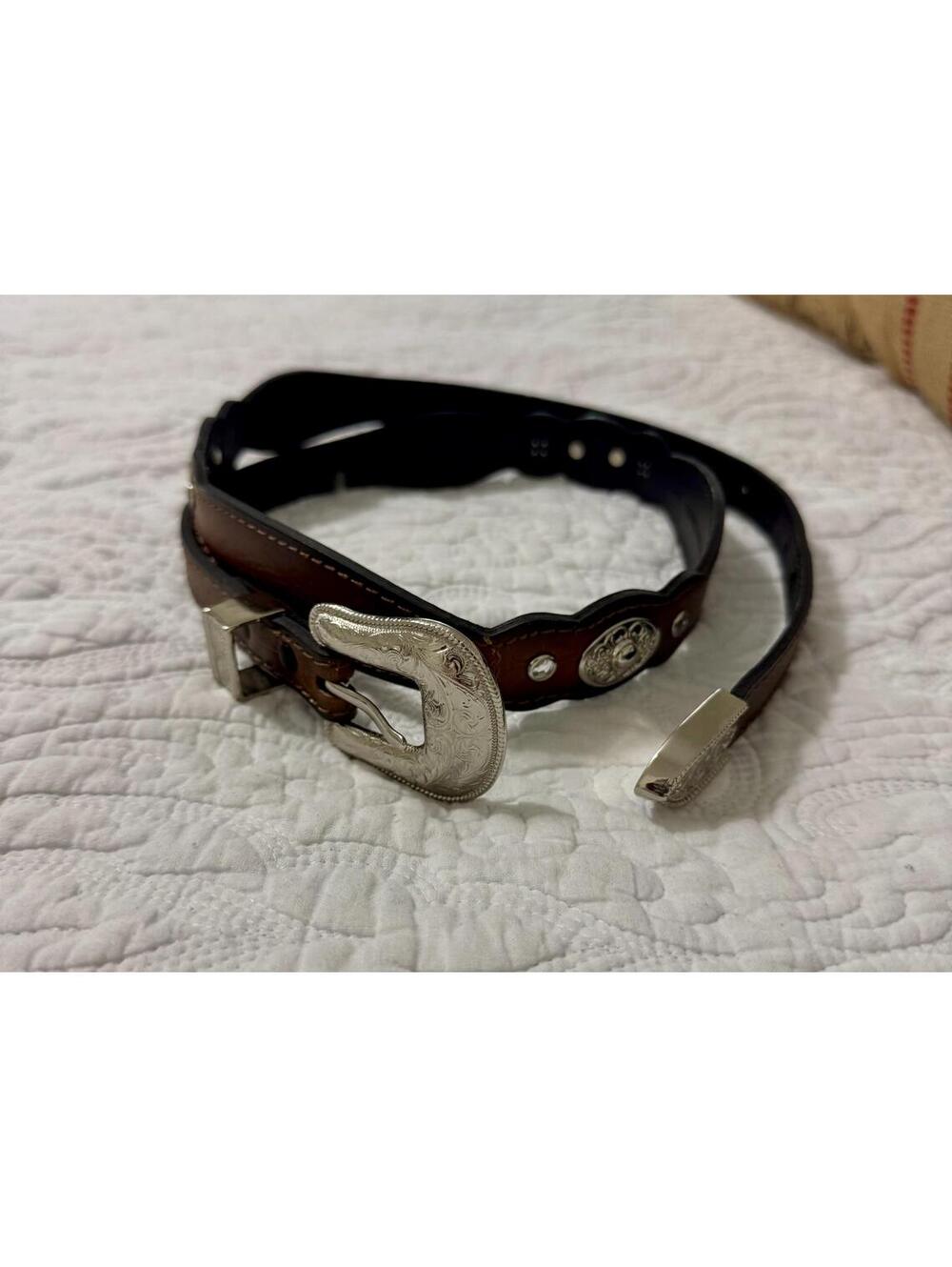Western  tooled leather hip belt with silver conch details